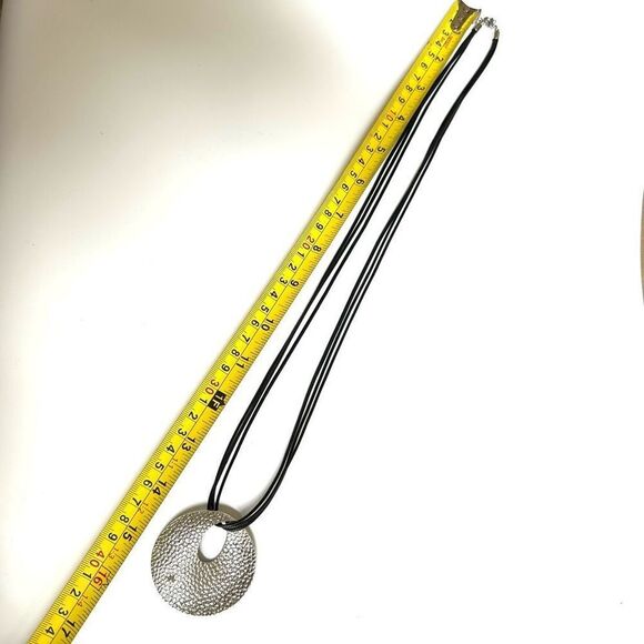 Round silver tone pendant necklace on long black cord - Picture 7 of 10